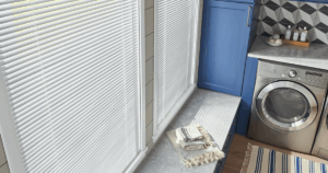 Blog 5 Laundry room with natural light filtering through white blinds – tip for maximizing daylight in utility spaces