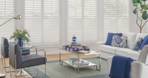Bright living room with faux white plantation shutters providing clean style, light control, and energy efficiency for Kansas City homes.