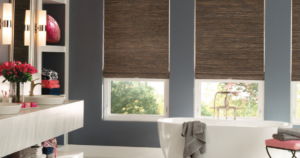 Light filtering woven shades in a modern bathroom, balancing natural light and privacy above the bathtub