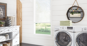 Natural shades filtering natural light in a bright laundry room with wood accents and textured decor for window treatments