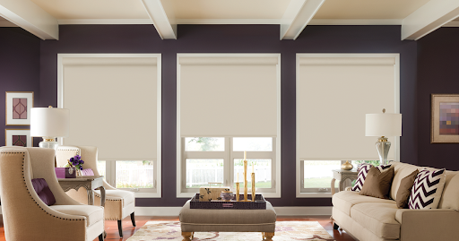 Blackout shades covering living room window treatments for privacy and adjustable light control